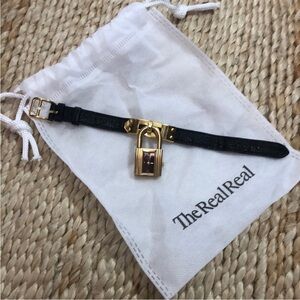 Hermes Kelly Black and Gold Bracelet with burgundy face watch